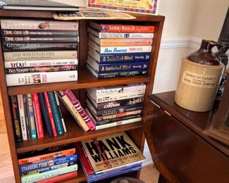 Bookcase full of country music books including Hank Williams