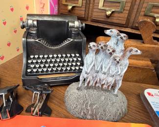 Decorative cast iron typewriter and meerkat figurine