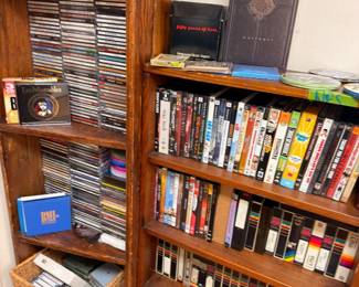 Wooden media cabinet with CDs books and stereo