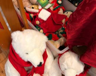 Plush polar bear family in Santa coats and elves