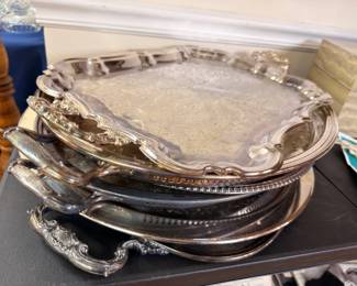 Stack of silver plated serving trays