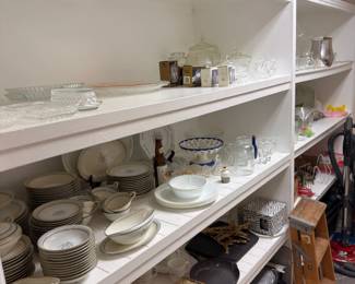 Built-in shelving with china, crystal, and serveware
