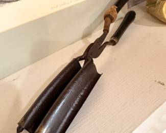 Antique cast iron curling iron with wooden handle