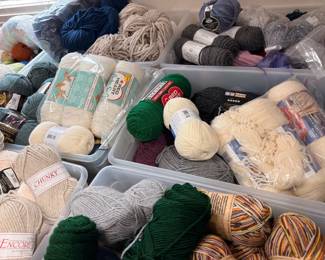 Bins of Encore yarn and specialty skeins