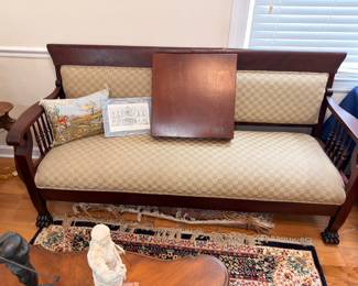 Antique mahogany claw-foot settee with dining leaf