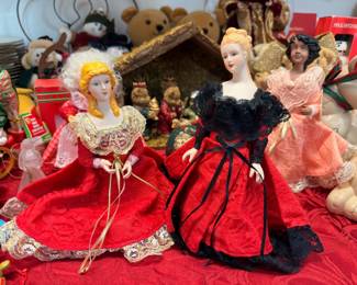 Vintage porcelain dolls in red gowns with nativity