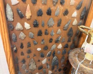 Native American arrowhead collection in framed shadowbox