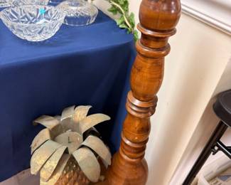 Tall turned wood candlestick with brass pineapple