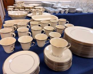 Ivory and gold rim china dinnerware service