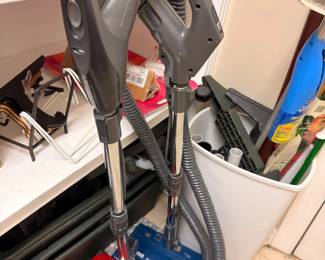 Upright vacuum cleaners and cleaning supplies