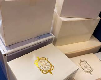 Boxed china or collectibles with gold medallion