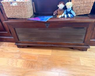 Wooden cedar chest trunk with Raggedy Ann dolls