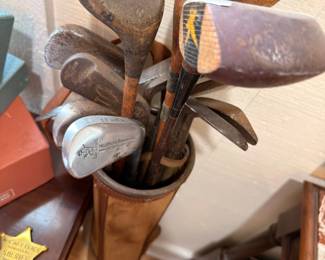 Antique wood shaft golf clubs in bag
