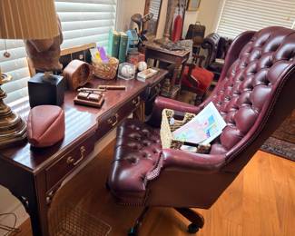 Burgundy tufted leather executive office chair with wood desk