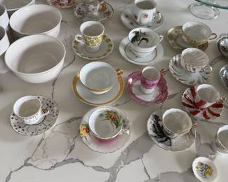 assortment of tea cups and saucers