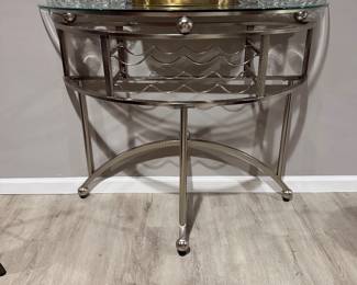 contemporary silver metal and glass server with a wine rack