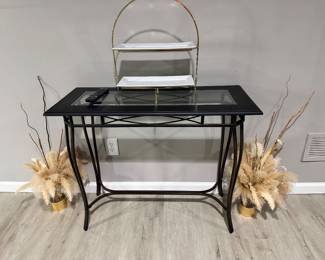 black metal console table with a glass top