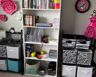 cozy craft room with a white 5-shelf bookcase & matching black folding shelves