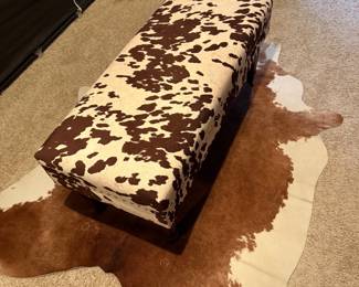 Storage Ottoman Bench featuring a brown and white cow print upholstery