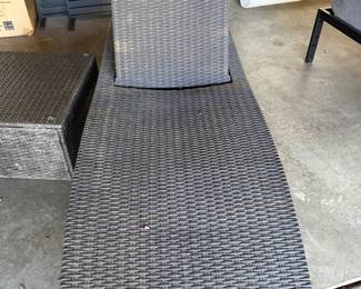 woven wicker outdoor chaise lounge chair.