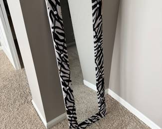 full-length floor mirror featuring a black and white zebra print
