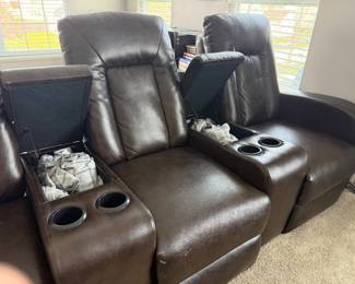 Home theater seating three (3) comfortable reclining seats with storage compartments and cup holders