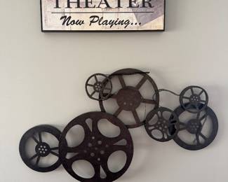 Bronze Metal Movie Reel Wall Art piece featuring various sizes of film reels connected together