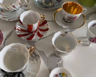 assortment of tea cups and saucers