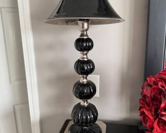 table lamp featuring stacked black glass spheres and a silver finish. 