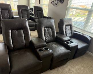 Home theater seating three (3) comfortable reclining seats with storage compartments and cup holders