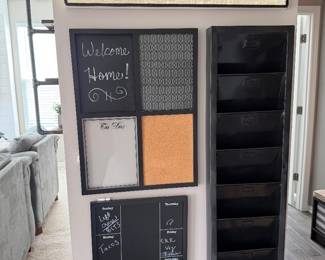 functional home decor family command center which features a combination of a chalkboard, corkboard, and a multi-slot mail organizer