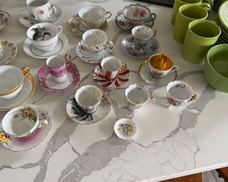assortment of tea cups and saucers