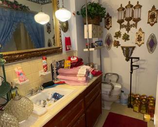 Downstairs bathroom, towels, pine cleaners, wall decor, glade plug ins
