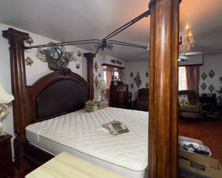 Upstairs primary bedroom Huge king 4 poster bed with mattress