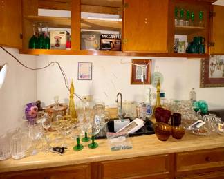 Bar area in Kitchen , amber glass, ruby glass, genie bottle