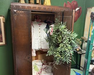 vintage children's clothing, vintage candlesticks, greenery