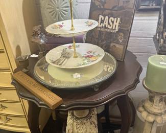 tiered stand, vintage side table, coffee table books, large wooden candlestick