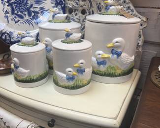 Vintage ceramic canister sets featuring hand-painted white geese or ducks
