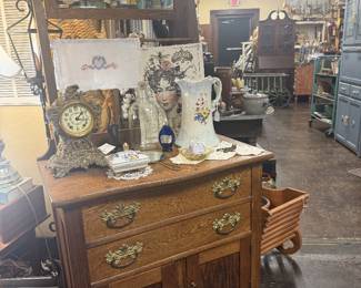 antique dresser with mirror, pitcher, art