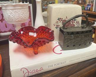 coffee table books, milk glass vase, brass iron