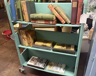 Vintage style green metal library cart, vintage books