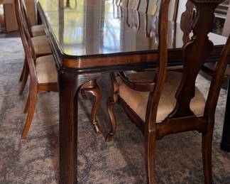 Drexel Heritage "Connoisseur Dining Table. Pictured with Set of 10 Drexel Heritage Fiddleback Dining Chairs. Table Measures 76" L x 40" D with 3 15.5" Leaves; 29" H with 26" Clearance. Photo 2 of 9. 