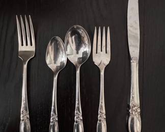 Oneida Community White Orchid Silverplate Flatware. Items Include: Knives - 8 Serving Spoons - 2 Salad Forks - 5 Forks - 8 Spoons - 15 Spoons - 8 Soup Spoon - 1. 