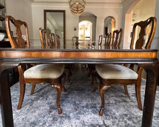 Drexel Heritage "Connoisseur Dining Table. Pictured with Set of 10 Drexel Heritage Fiddleback Dining Chairs. Table Measures 76" L x 40" D with 3 15.5" Leaves; 29" H with 26" Clearance. Photo 3 of 9. 