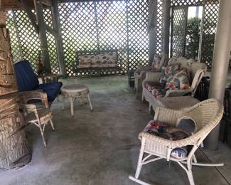 Wicker furniture with cushions porch swing