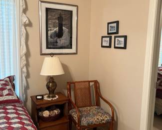 Return cane chair, side table, framed artwork