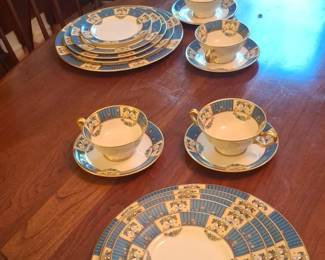 Porcelain Teacup and Saucer Set with Blue and Gold Trim fourth image