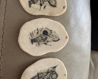 #98 - $150 - Set of three scrimshaw art of Eskimo 2 inches each
