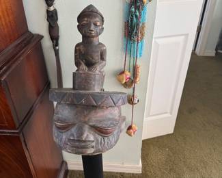 #18 - $350 - Gelede Mask, Nigeria, wood and mineral polychromy. First half of the 20th centuryTribal african carved wood face with child on top 42 x 12 on pedestal