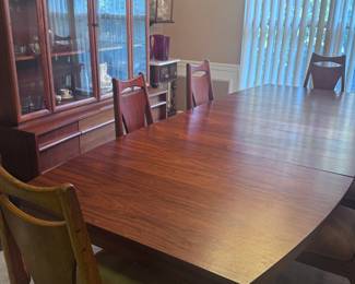 Vintage Danish Teak Expandable Table w/six high back chairs, a tablecover and Teak Glass Front Hutch
